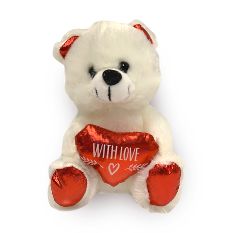 Teddy bear holding a red heart
