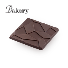 Bakery tables of dark chocolate and cocoa beans