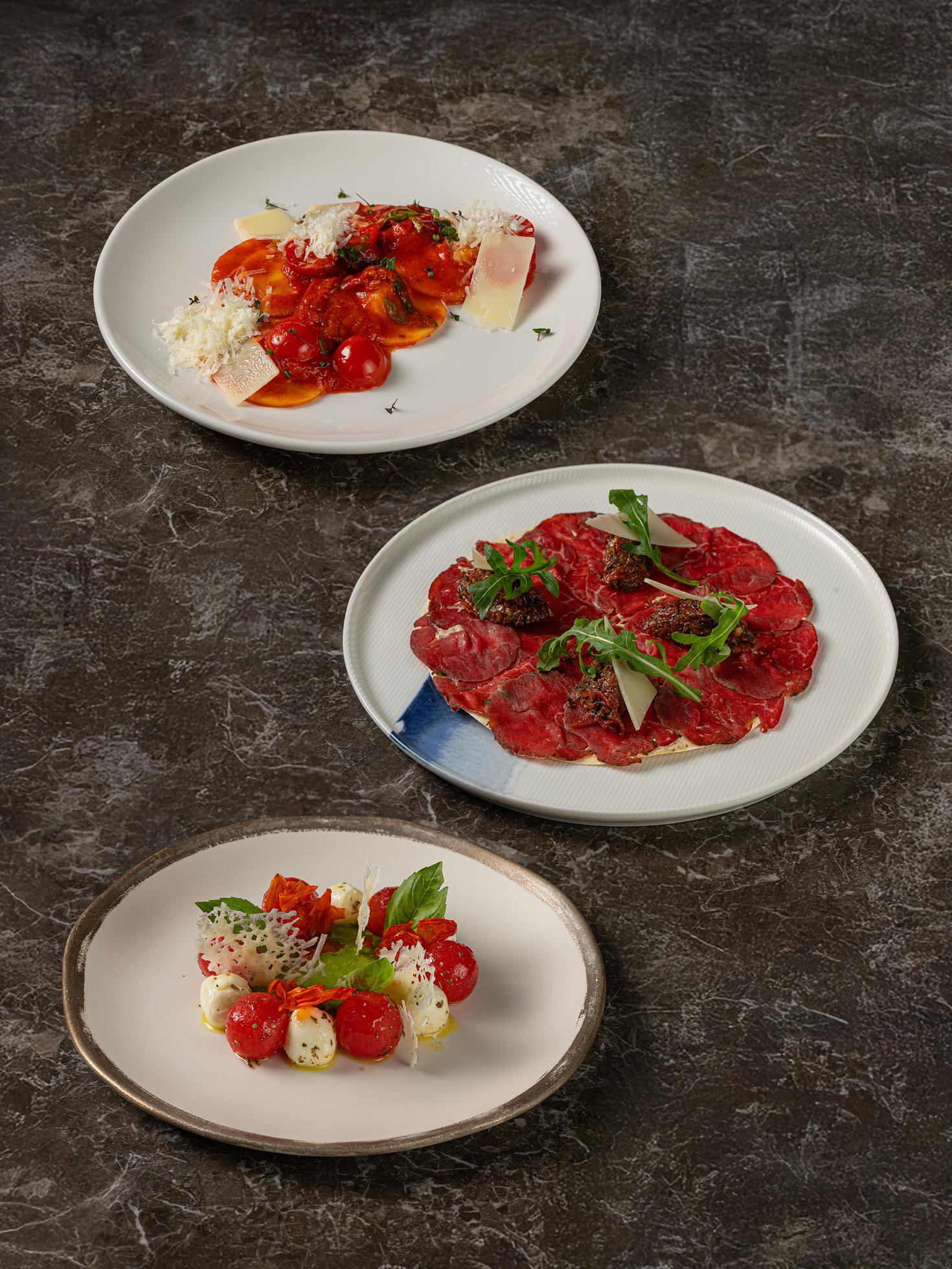 Eggplant ravioli, smoked beef carpaccio, Caprese salad