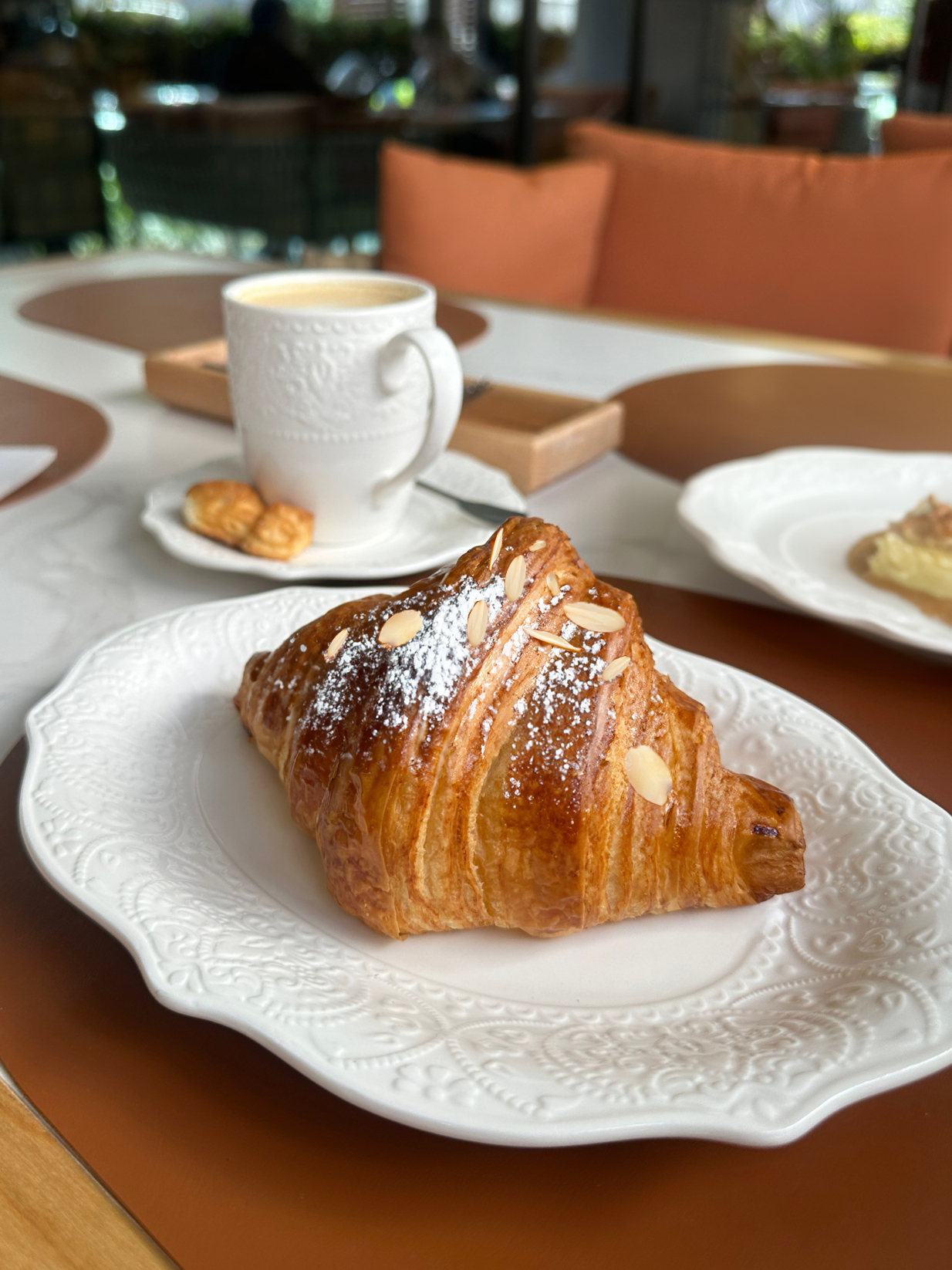 Almond croissant and latte with bounty flavor