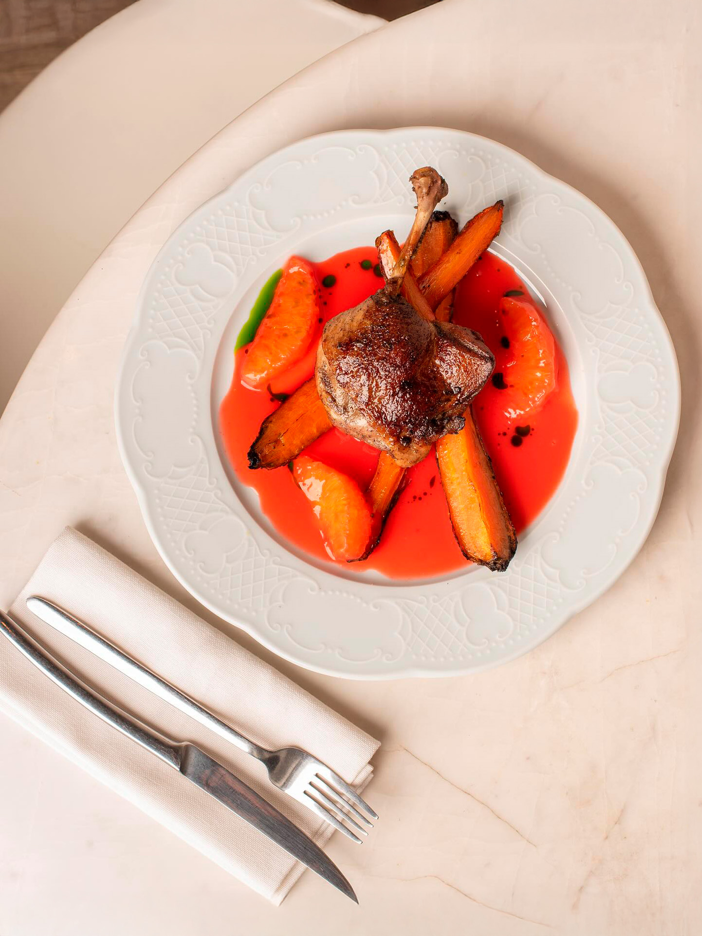 Duck leg with baked carrots