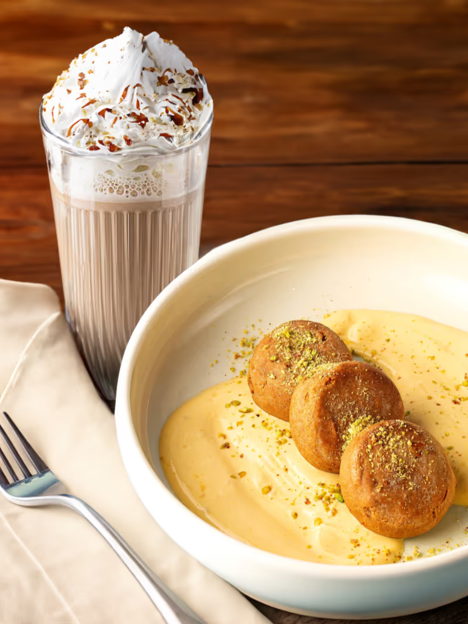 Cheesecakes made from melted irimshik in yogurt and mango sauce and raf
