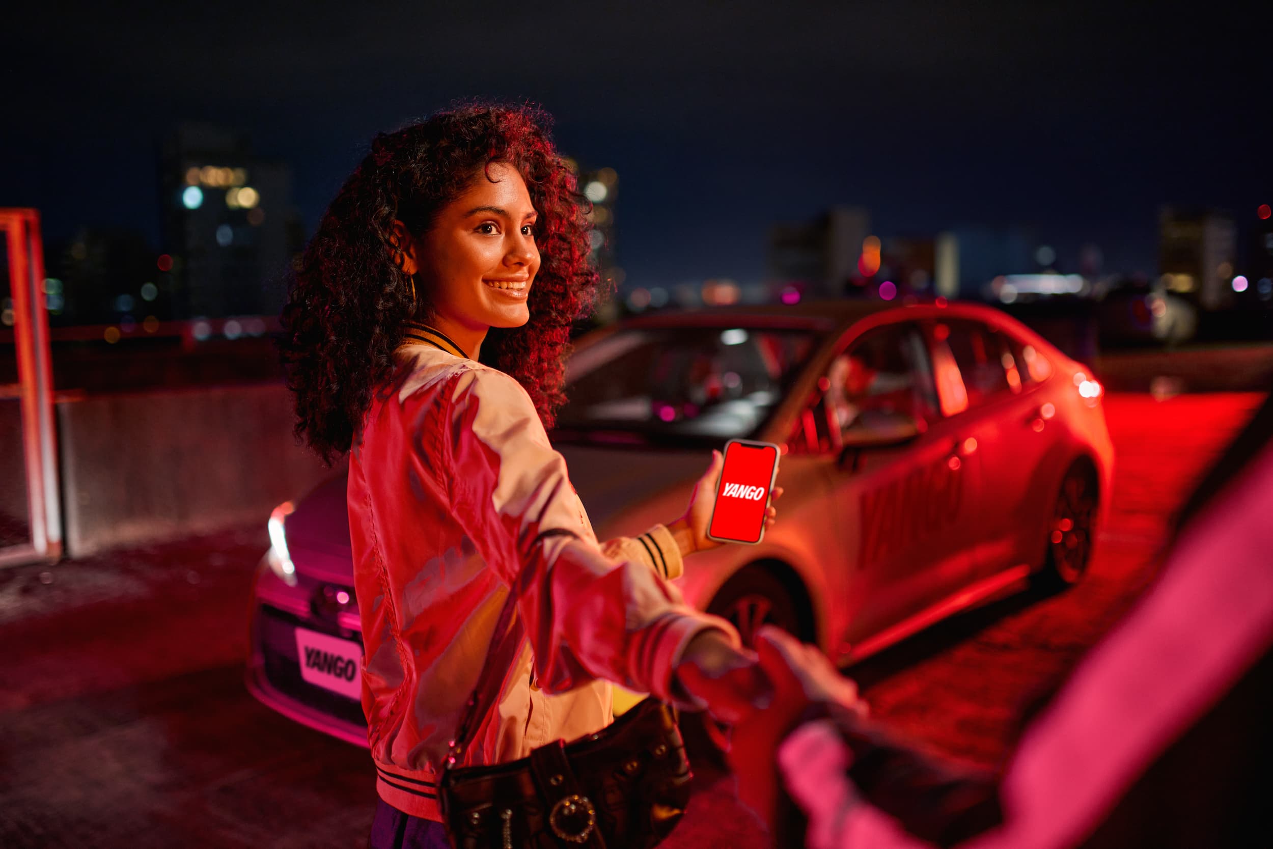 A woman approaching a taxi