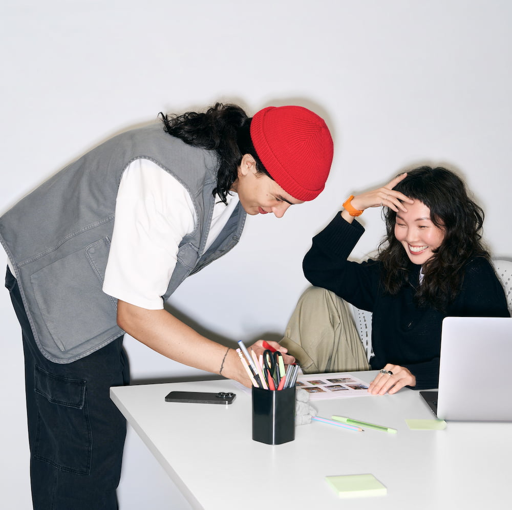 A man and a woman looking at a set of images