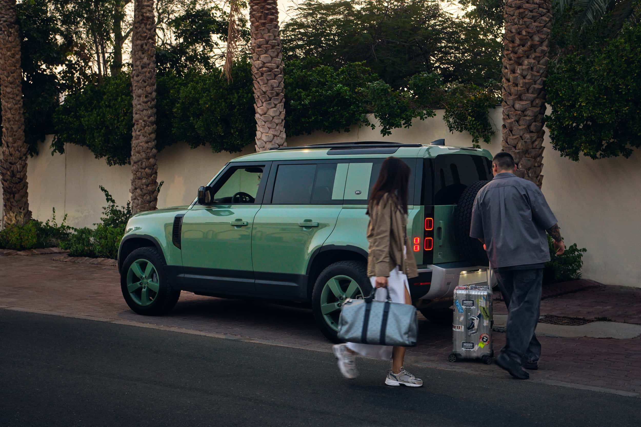 People approaching a car