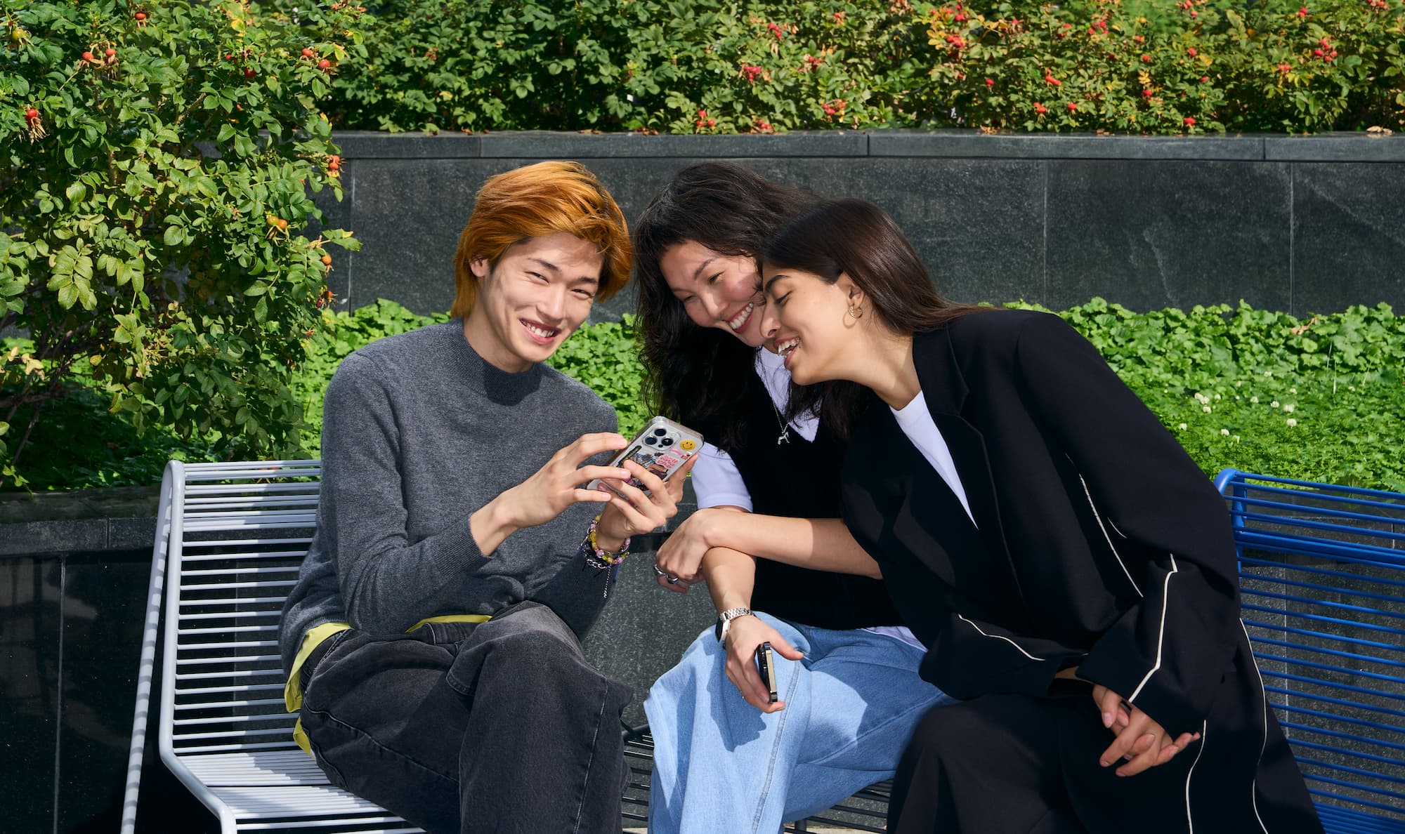 Happy people looking at a phone